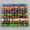A set of ten multicolor acrylic dice with rounded corners arranged in a grid.