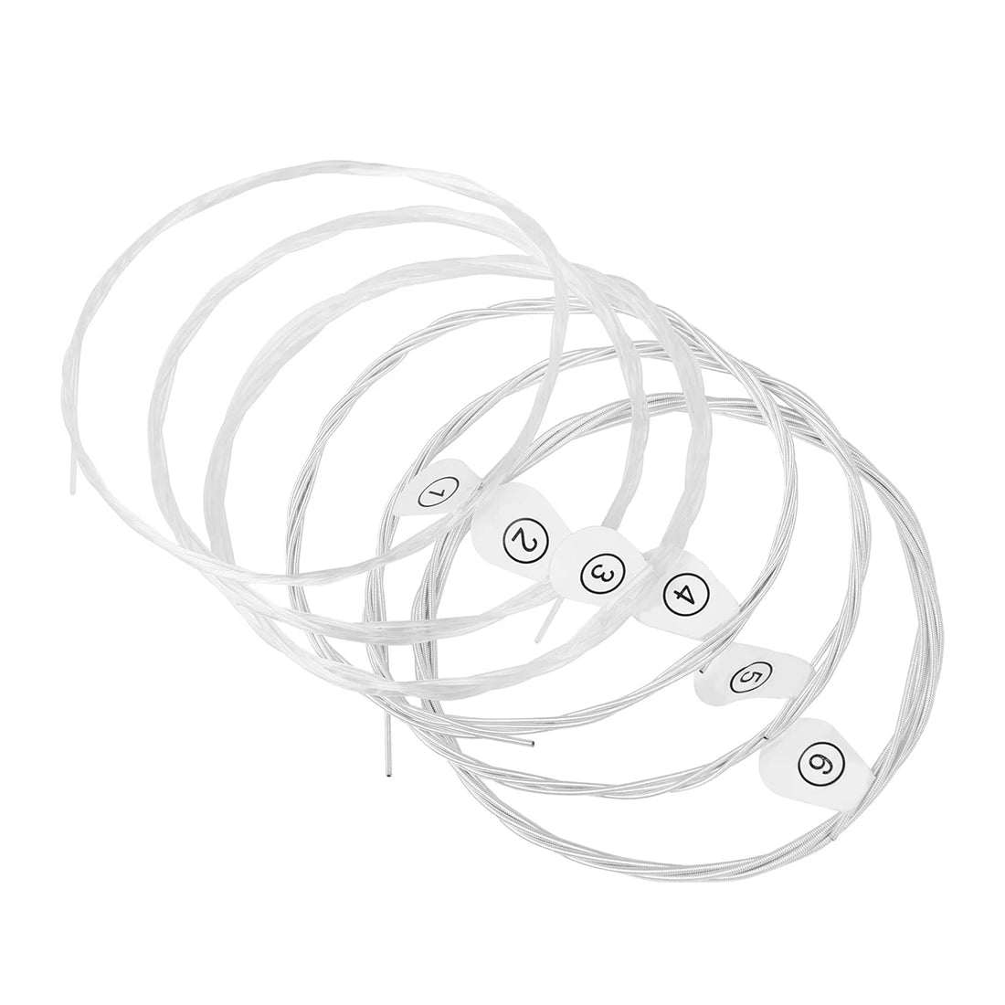 A coil of clear nylon and silver-plated copper wound classical guitar strings.
