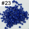 A pile of 1000 small blue fuse beads for creative craft projects.