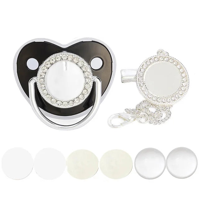 A set of baby pacifiers and clips with rhinestone accents shown alongside several white silicone pacifier components.