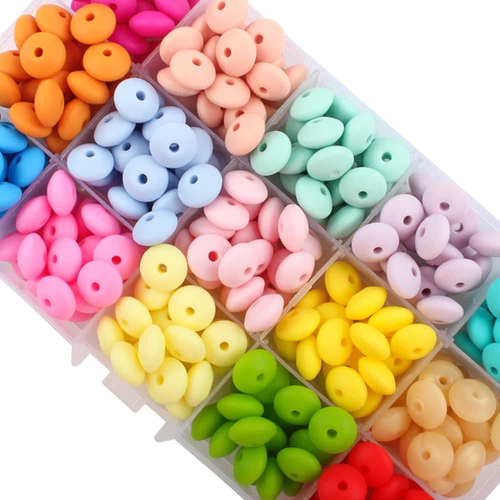 Assortment of colorful silicone lentil beads in various shades including orange, pink, blue, and green.