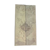 An old, aged map or document with ornate text and illustrations on a light background.