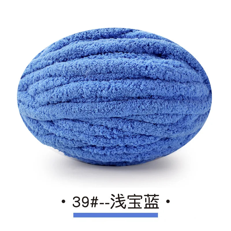 A ball of blue chunky chenille yarn used for hand knitting projects.