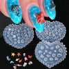 A hand holds a teal silicone nail art mold featuring sea shell, starfish, and ocean designs.