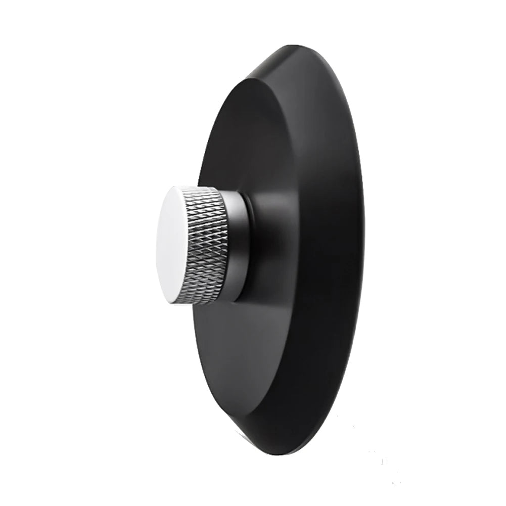 A black aluminum alloy record stabilizer with a silver textured knob.