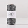 Spool of black metallic yarn for knitting and crochet thread