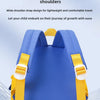 A blue kids' cartoon digger truck backpack with yellow straps shown from the back.