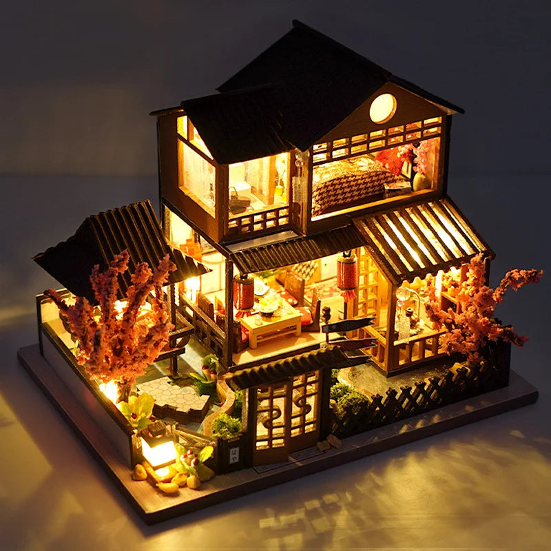 A detailed wooden mini seaside villa dollhouse kit featuring furniture and decorative elements.