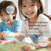 Two children play an Animal Flip Chess Memory Matching Game on a wooden board.