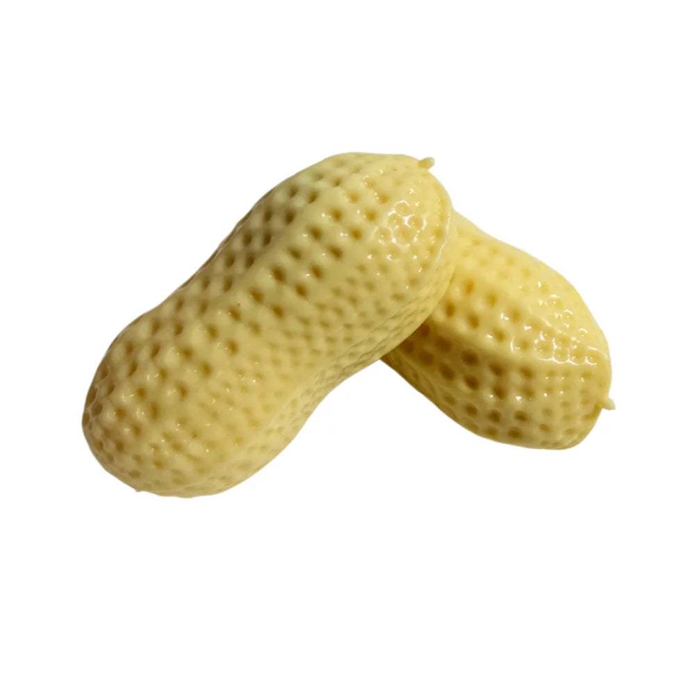A light yellow peanut squishy stress ball with a textured surface, shown from the side.