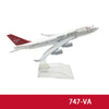 A diecast model of a Virgin Atlantic airplane in white and red livery.