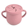 A pink BPA-free silicone snack cup with a lid is shown against a white background.