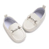 White baby first walker sneakers with a dinosaur print detail