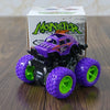 A purple monster truck toy with green wheels is displayed in front of its packaging.