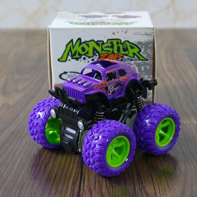A purple monster truck toy with green wheels is displayed in front of its packaging.