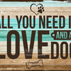 A distressed wooden background with text that reads All you need is love and a dog, featuring a paw print icon.