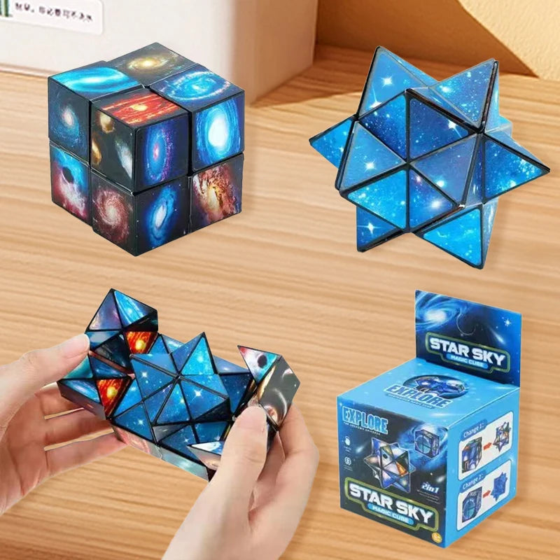 A hand holds a blue geometric puzzle cube shaped like a star, next to its packaging box.