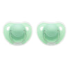 A pair of light green silicone pacifier covers with protective openings for baby soothers