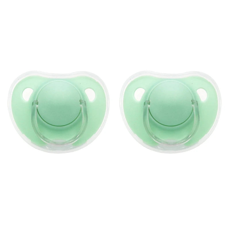 A pair of light green silicone pacifier covers with protective openings for baby soothers