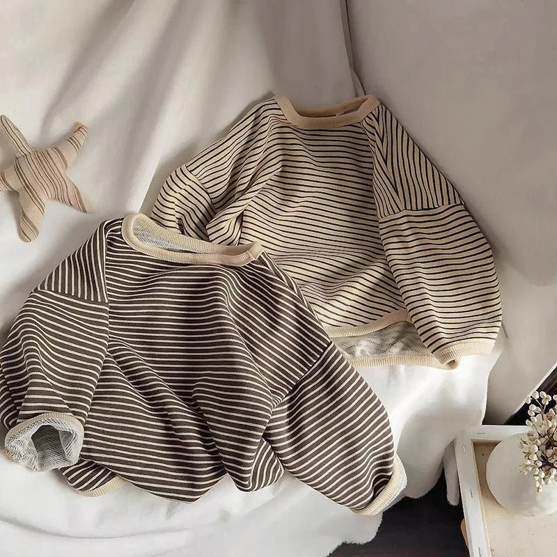 A beige and brown striped kids cotton pullover sweatshirt laid flat on a white surface.