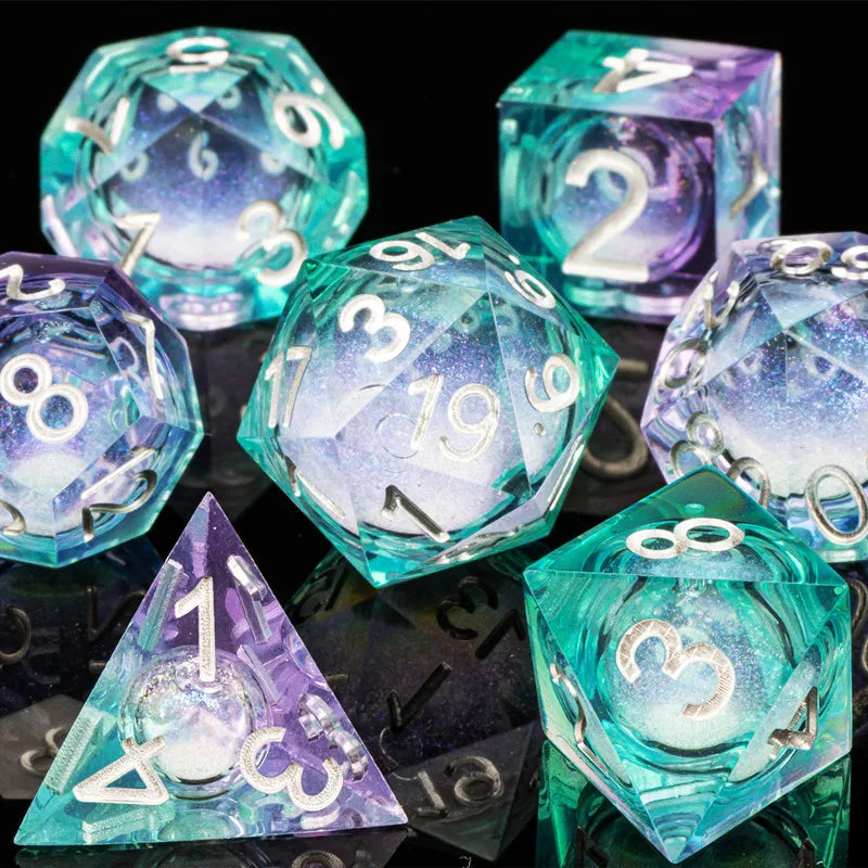 A collection of translucent teal and purple liquid core dice, including d6s and d8s, displayed on a dark surface.