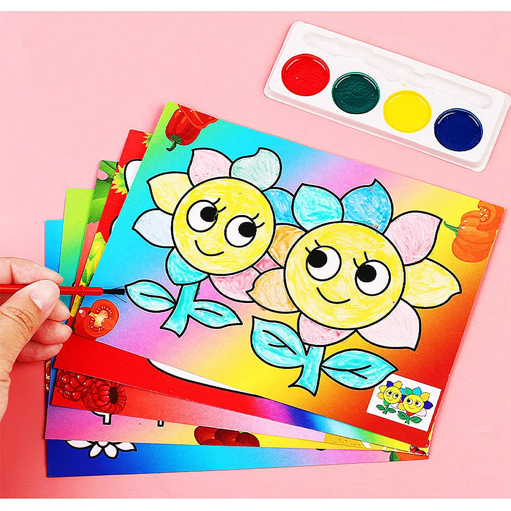 A set of colorful paint and paper for a DIY cartoon coloring painting kit for kids