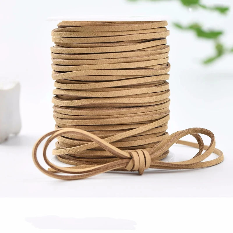 A stack of tan velvet faux suede braided ribbon rolls for crafting and gift wrapping.