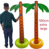 An orange inflatable palm tree with green fronds is shown next to a larger yellow version.