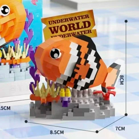 An orange and black shark building block model is shown on a gray base, part of an ocean animal set.