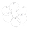 A set of six clear nylon and silver-plated copper wound classical guitar strings arranged in a circular pattern.