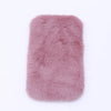 A rectangular, fluffy, dusty rose colored miniature carpet mat for dollhouse decor.