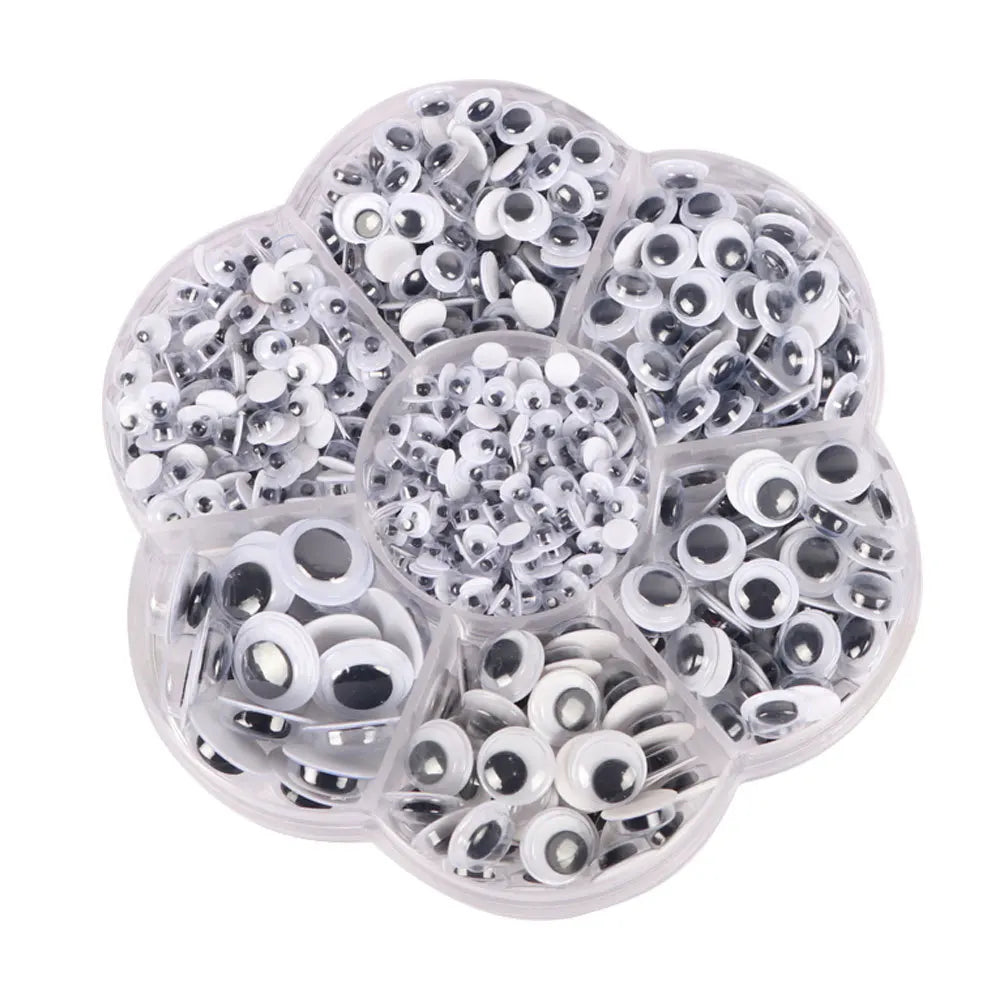A clear plastic container filled with various self-adhesive moving eyes for crafts and DIY decorations.