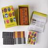 A collection of maskmen board game boxes and components displayed on a white surface.