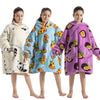 Three girls wearing cozy kids flannel hoodie sweaters in pastel colors