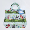 A light blue fabric bag featuring a pattern of various woodland animals and mushrooms.
