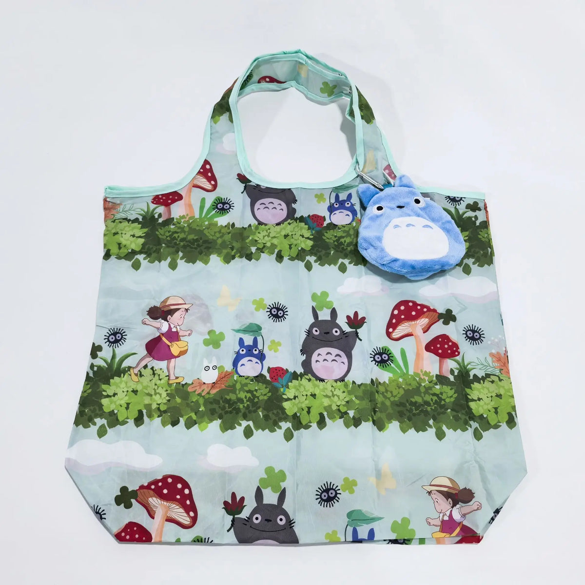 A light blue fabric bag featuring a pattern of various woodland animals and mushrooms.