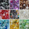 Collection de perles de séparation en verre colorées dans diverses nuances, y compris rose, violet, vert et transparent.