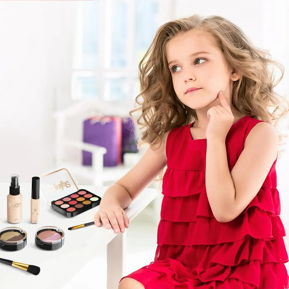 A young girl holds a red ruffled dress and touches her cheek while looking at makeup products.
