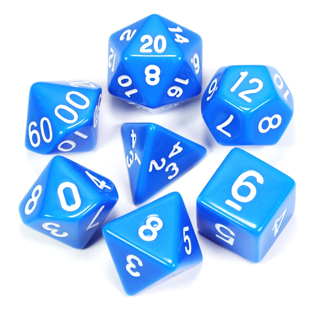 A collection of blue acrylic dice, including a d10 and d20 shapes, scattered on a white surface.