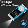 Blaues LED-Licht MP3-Musikwiedergabegerät mit Lichtstrahl auf der Oberfläche.