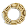 A coil of round braided gold-colored leather cord used for jewelry making and DIY crafts.