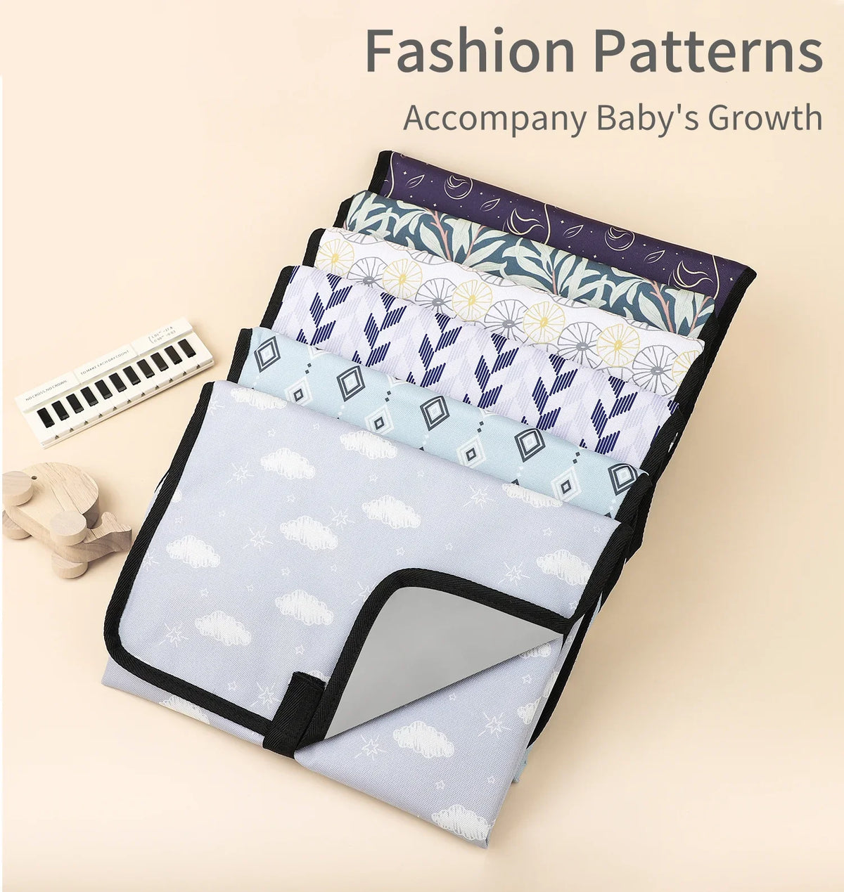 A stack of various patterned fabric fashion patterns for accompanying a baby's growth.