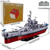 A detailed model kit of the Bismarck Battleship shown in a gray and red color scheme.