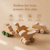 A wooden dinosaur teether toy car is shown with text describing endless fun from screen-free play.