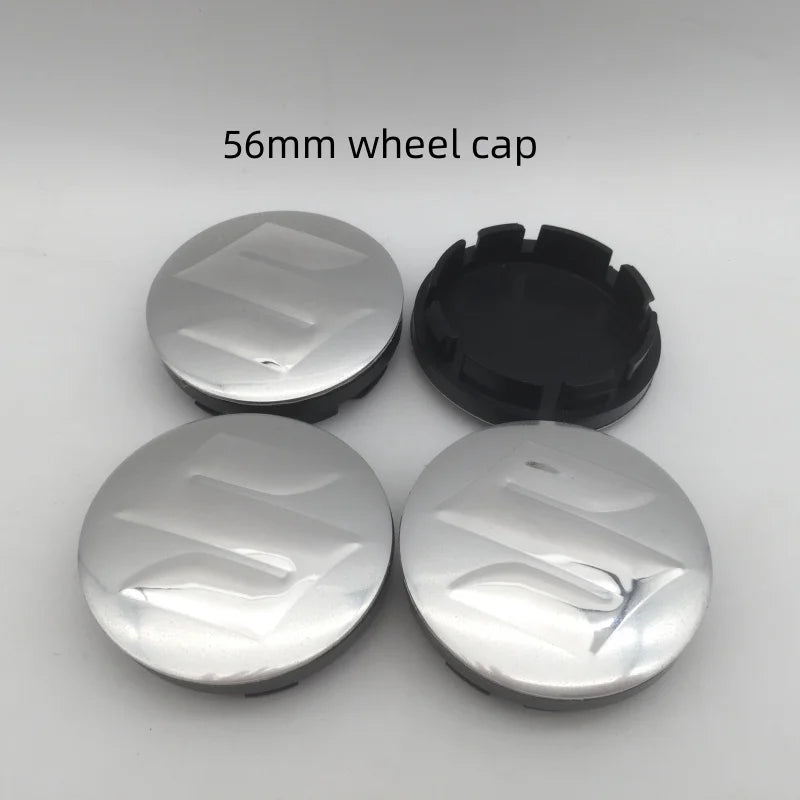 Three 56mm silver wheel caps are displayed on a white background.