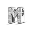 A personalized sterling silver alphabet charm bead shaped like the letter M, encrusted with cubic zirconia stones.