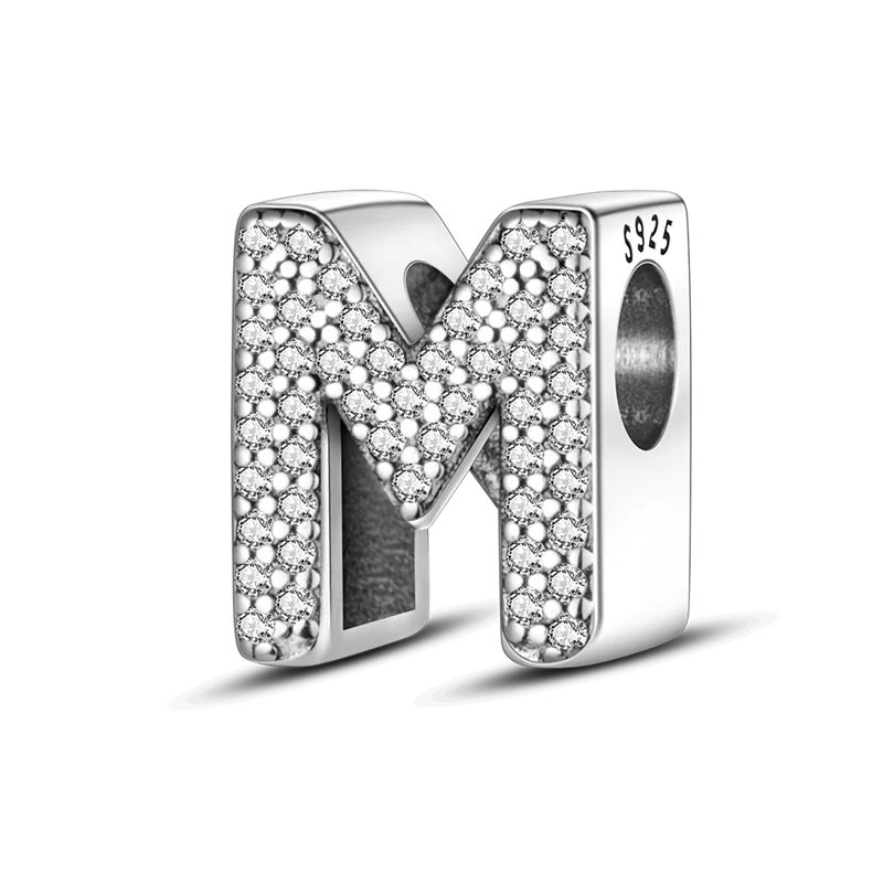 A personalized sterling silver alphabet charm bead shaped like the letter M, encrusted with cubic zirconia stones.