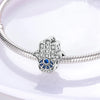Sterling silver charm beads set featuring cross, angel, and evil eye designs for DIY jewelry making