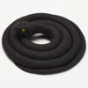 A realistic black rubber snake toy coiled on a white background.