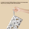 A hand is holding a folded portable baby changing mat with a carry handle, demonstrating its convenient and foldable design.